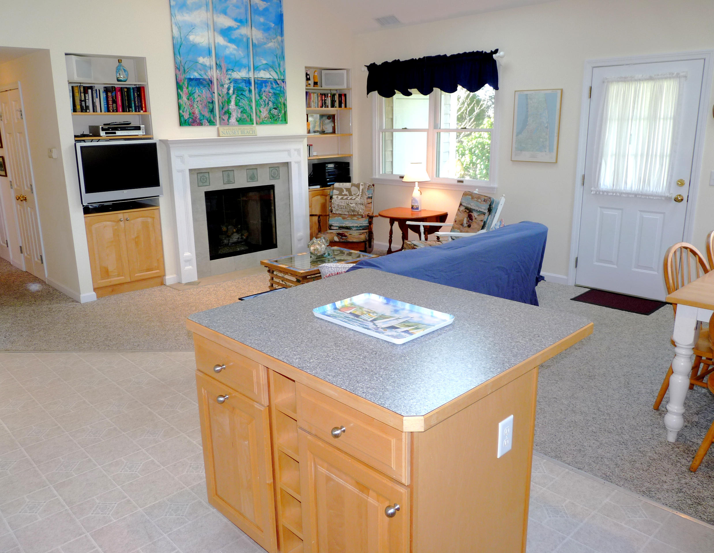 170 Beach Road, Unit 10 Orleans, MA 02653 - Photo 5 of 23 a living room with furniture and a fireplace