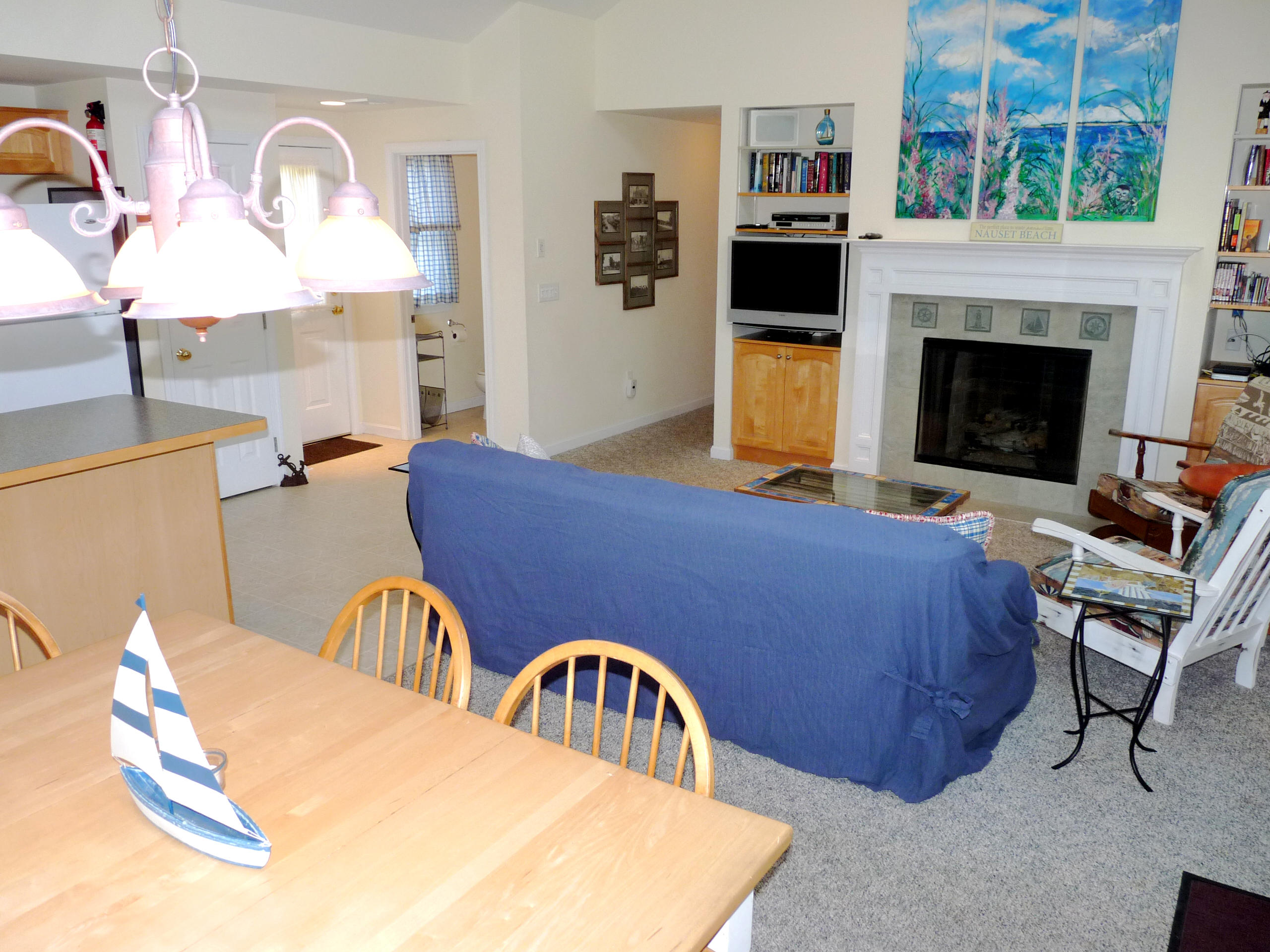 170 Beach Road, Unit 10 Orleans, MA 02653 - Photo 6 of 23 a bedroom with furniture and a fireplace