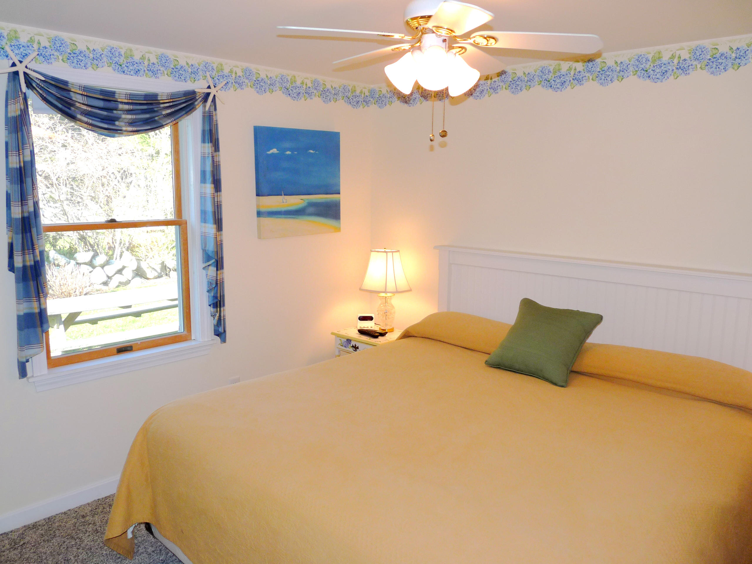 170 Beach Road, Unit 10 Orleans, MA 02653 - Photo 10 of 23 a bedroom with a bed dresser and window