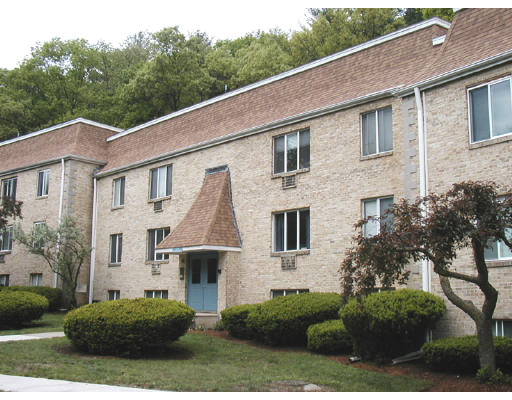 294 Swanson Road, Unit 211 Boxborough, MA 01719 - Photo 1 of 1 a view of a white house next to a yard
