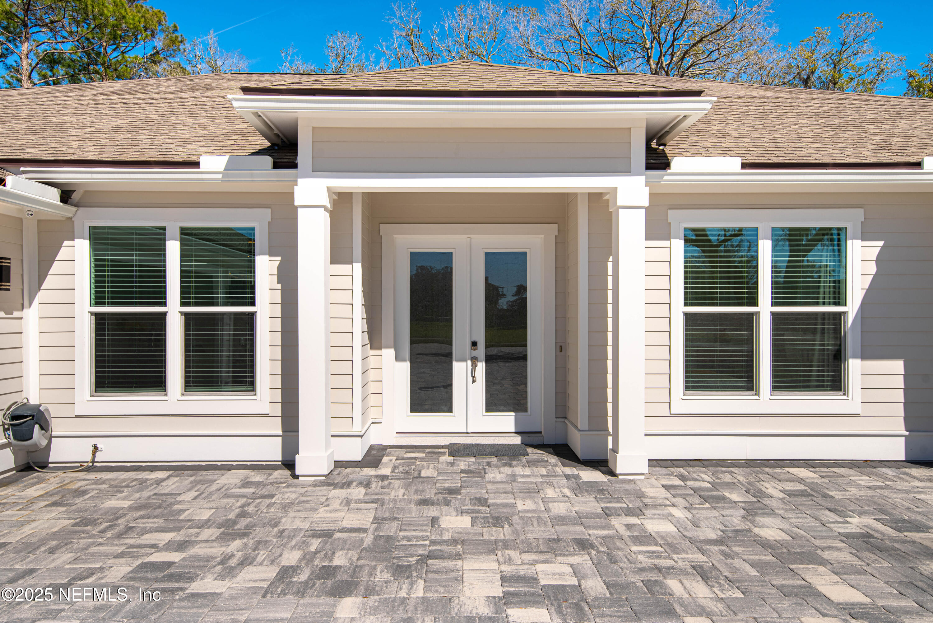 95494 Arbor Lane Fernandina Beach, FL 32034 - Photo 11 of 45 a view of a entrance of the house with a window and a tree