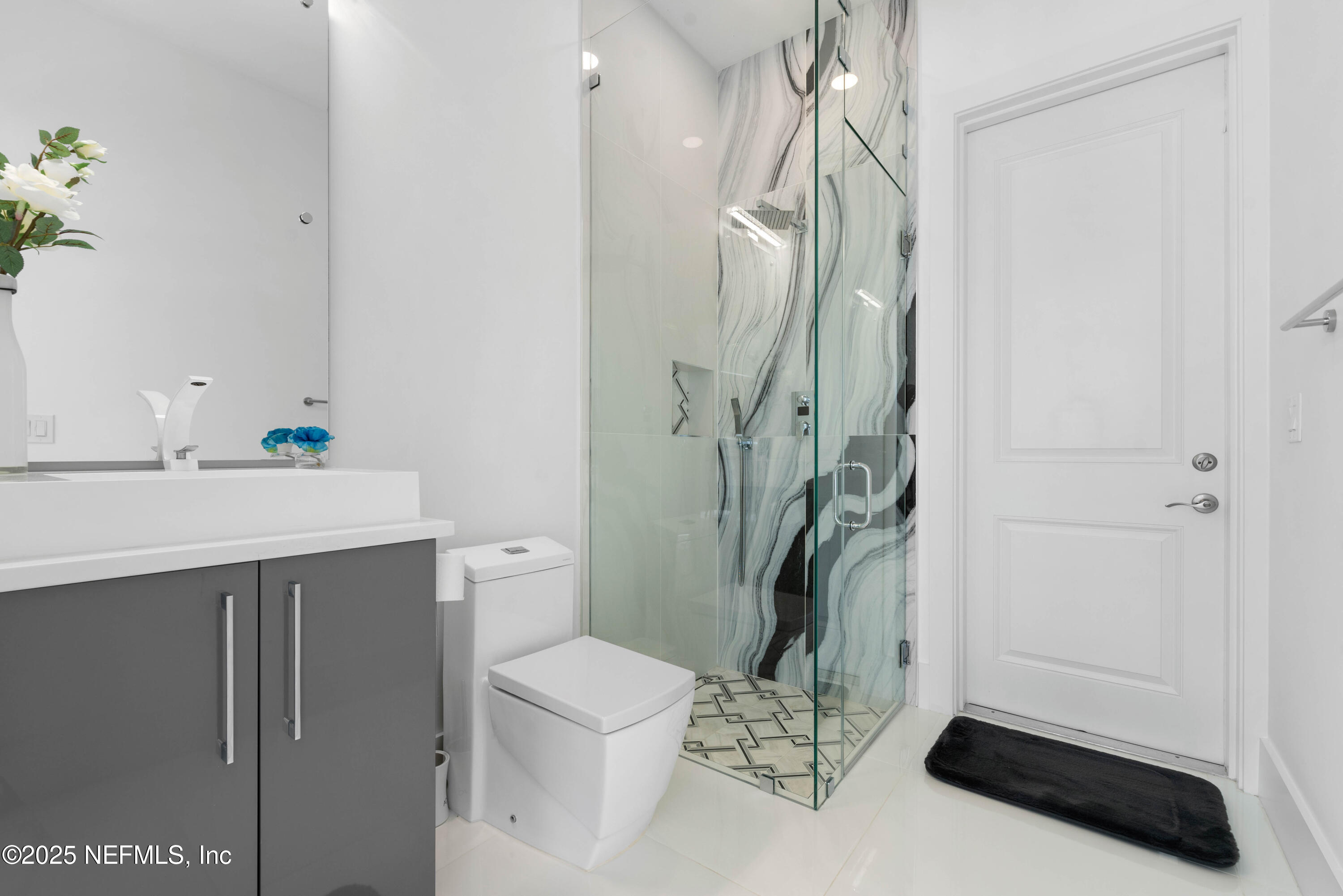 95494 Arbor Lane Fernandina Beach, FL 32034 - Photo 16 of 45 a bathroom with a sink a toilet and shower