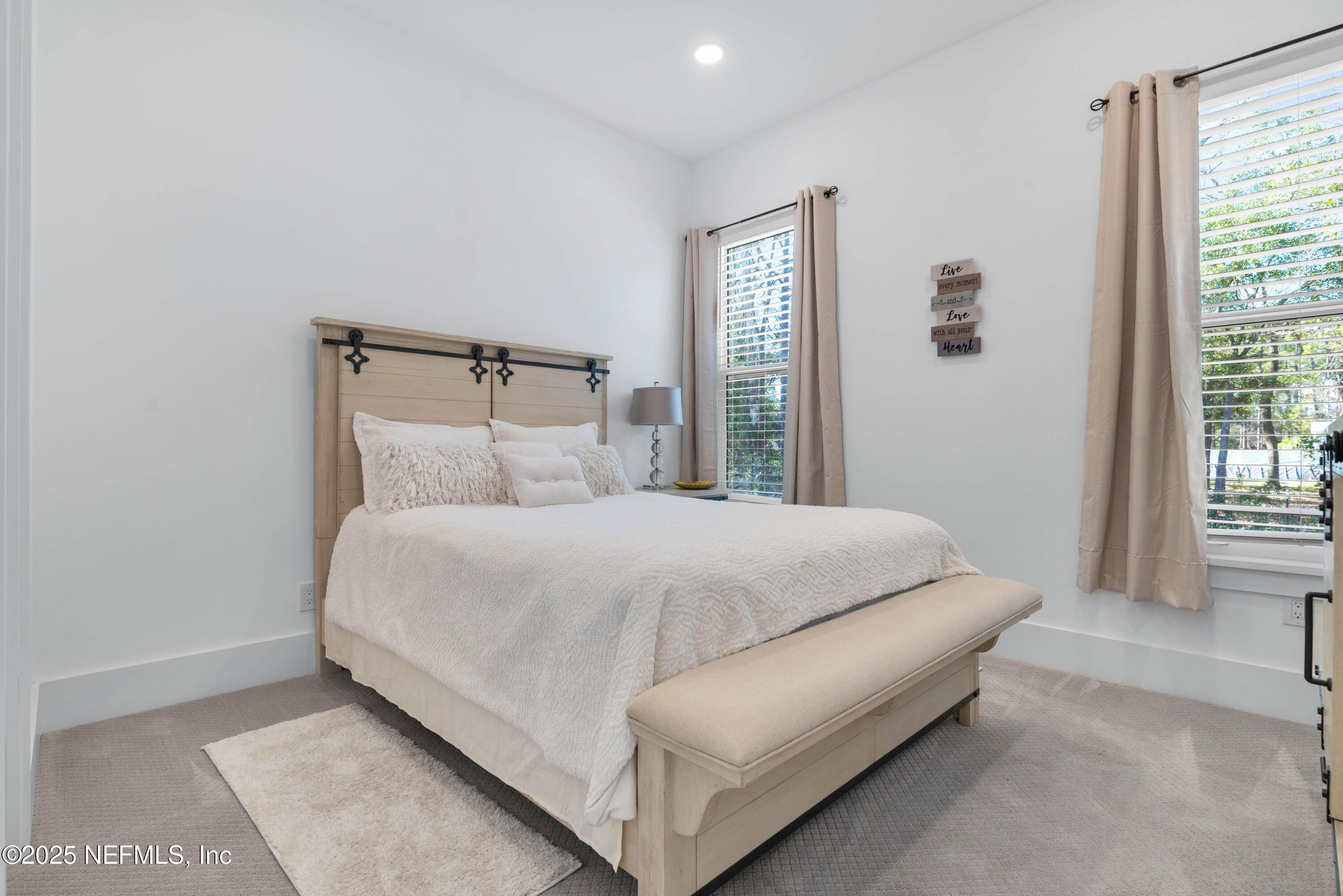 95494 Arbor Lane Fernandina Beach, FL 32034 - Photo 17 of 45 a bed sitting in a bedroom next to a window