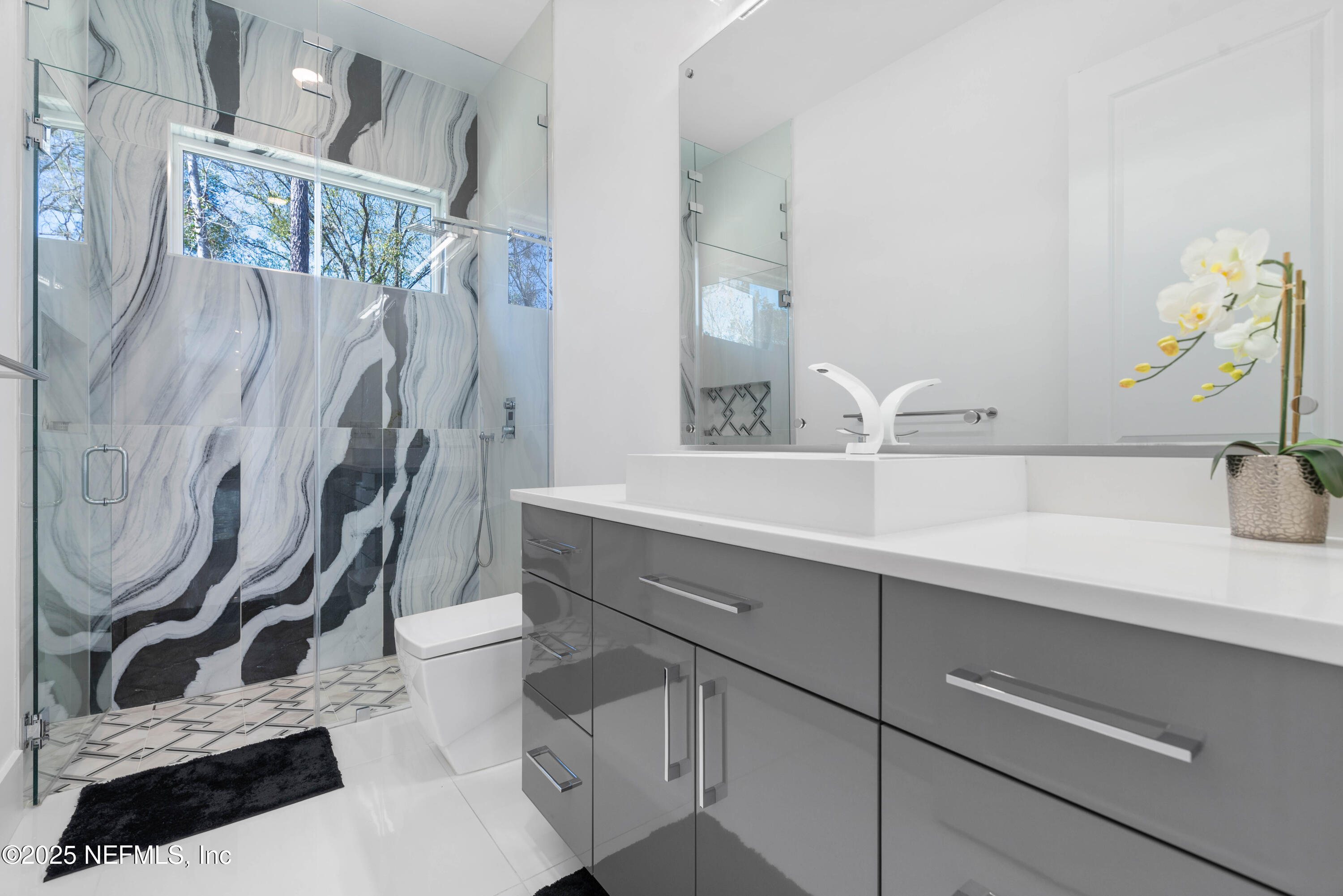 95494 Arbor Lane Fernandina Beach, FL 32034 - Photo 18 of 45 a bathroom with a sink and a mirror