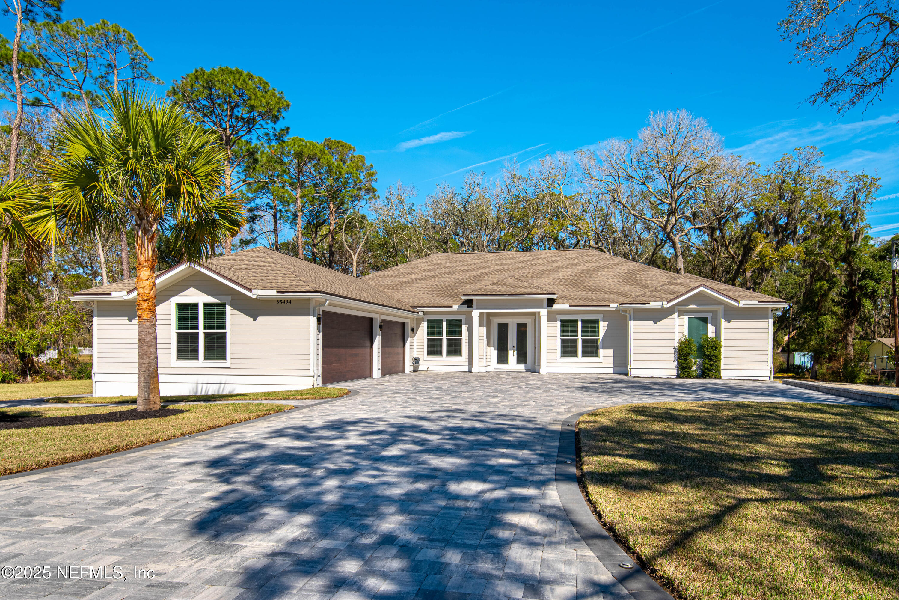 95494 Arbor Lane Fernandina Beach, FL 32034 - Photo 3 of 45 a front view of a house with a garden