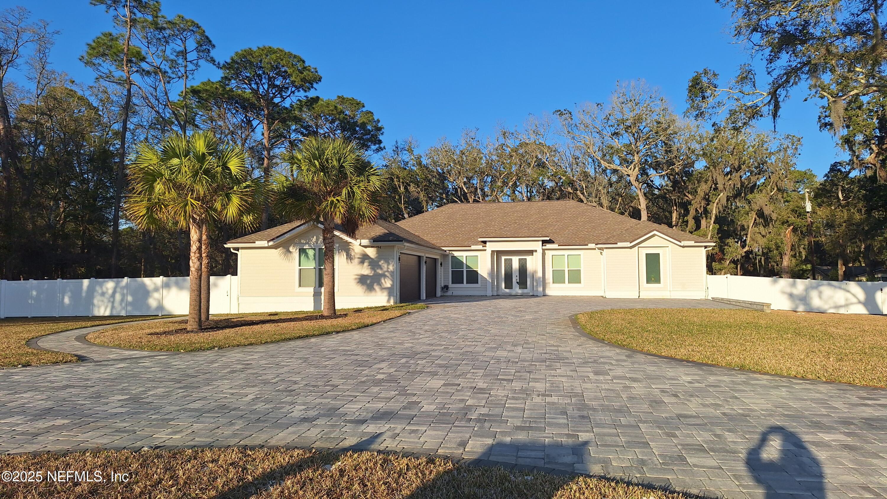 95494 Arbor Lane Fernandina Beach, FL 32034 - Photo 10 of 45 a front view of a house with a yard