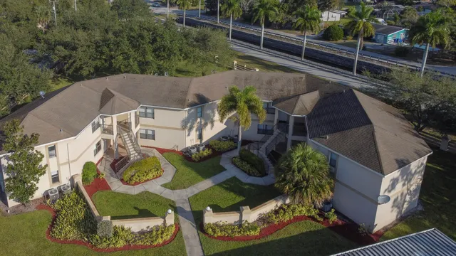 an aerial view of house with yard