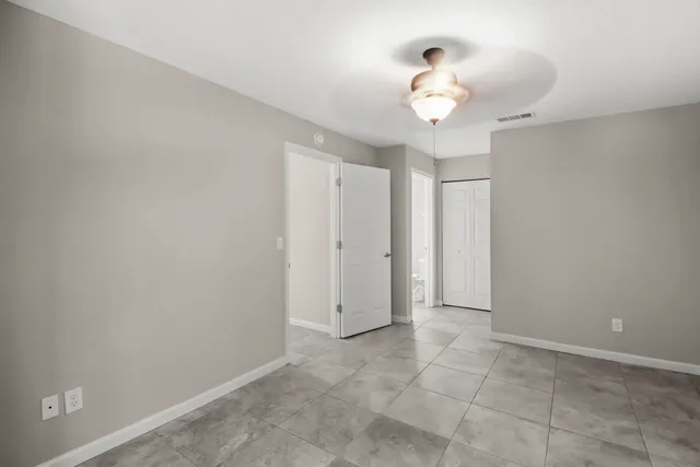 a view of an empty room with a window