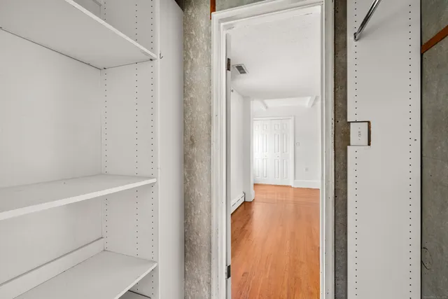 a view of a hallway with workspace