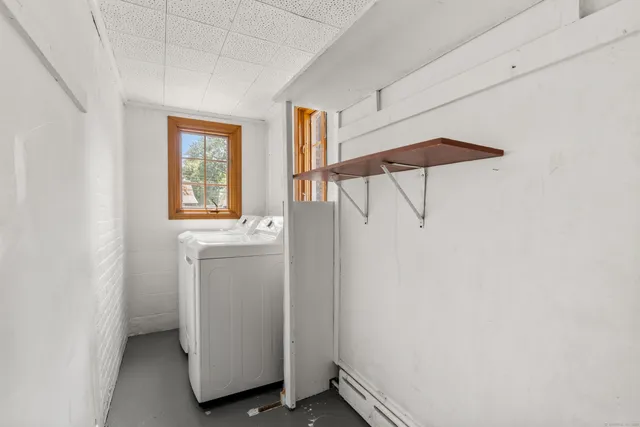 a bathroom with a toilet a sink and a mirror
