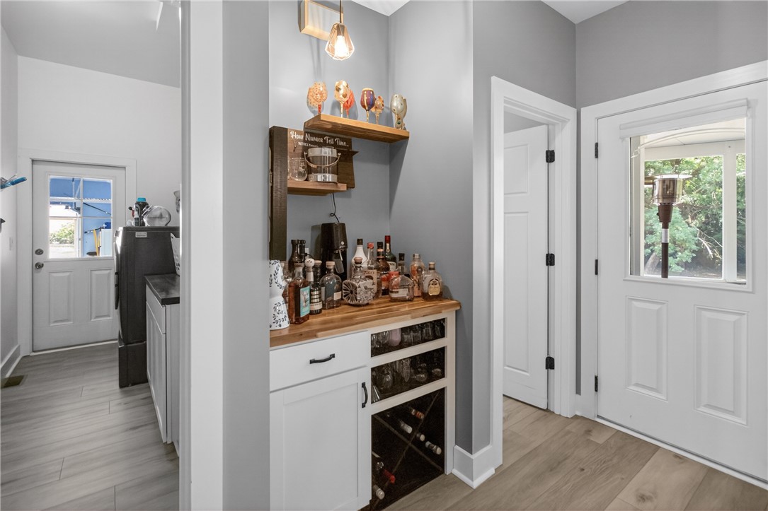 1504 Double Springs Road Townville, SC 29689 - Photo 17 of 41 This versatile area offers both a functional laundry space and a stylish dry bar, ideal for everyday living and entertaining.