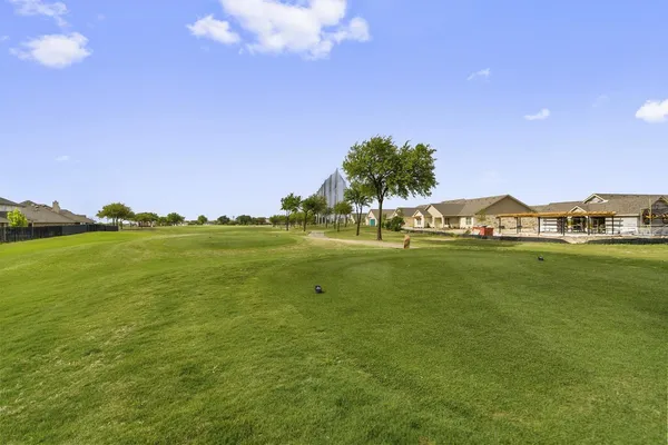 a view of a water with houses in the background