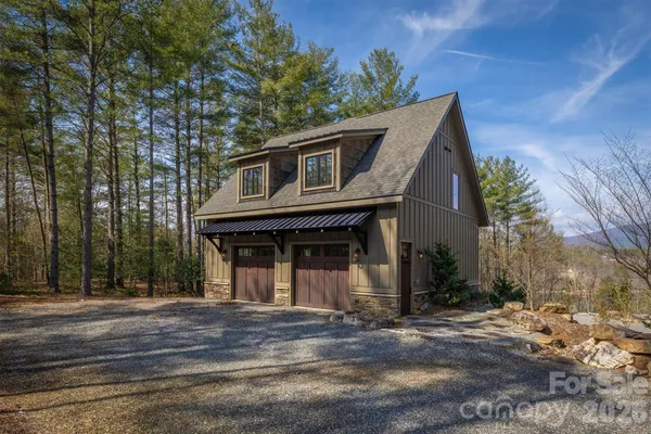a front view of a house with garage