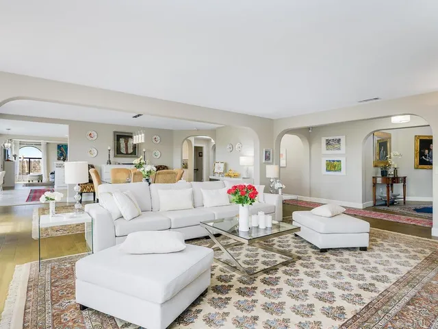 a large kitchen with a sink and cabinets