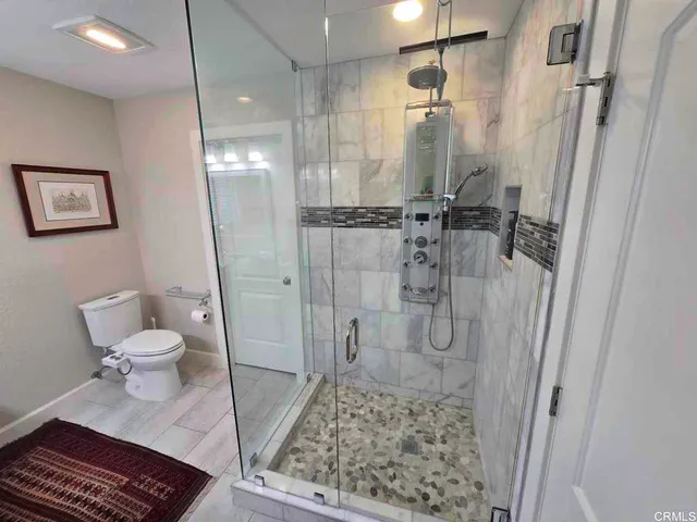 a view of a living room and a large window