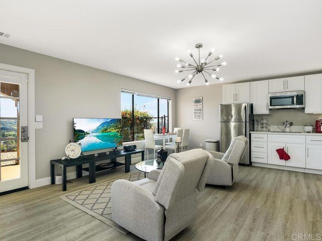 a bedroom with a large bed and a large window