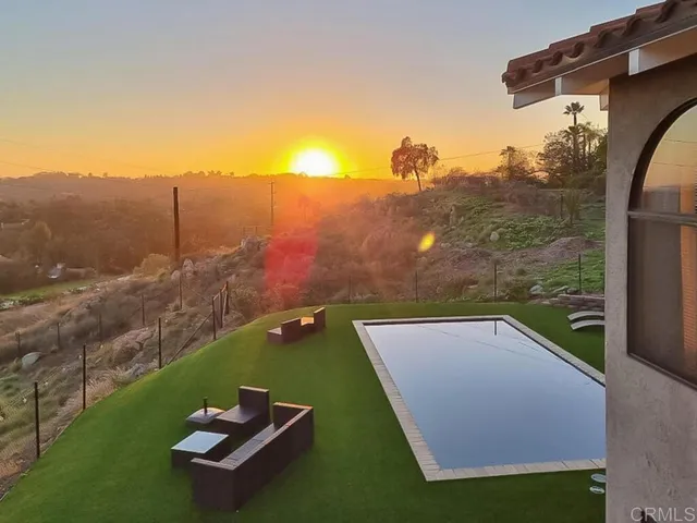 a view of a backyard of a house