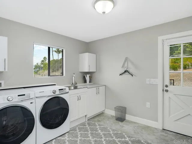 a front view of a house with sitting area