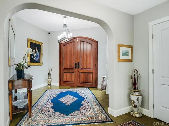 a view of a dining room with furniture and a window