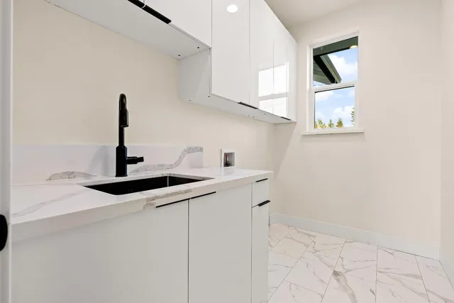 a view of a backyard with wooden fence