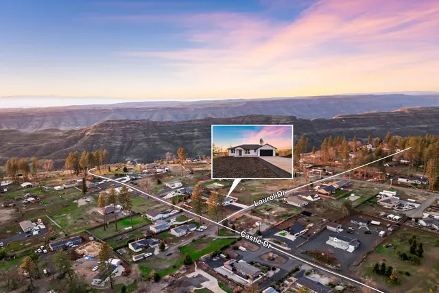 a view of a city with mountains in the background
