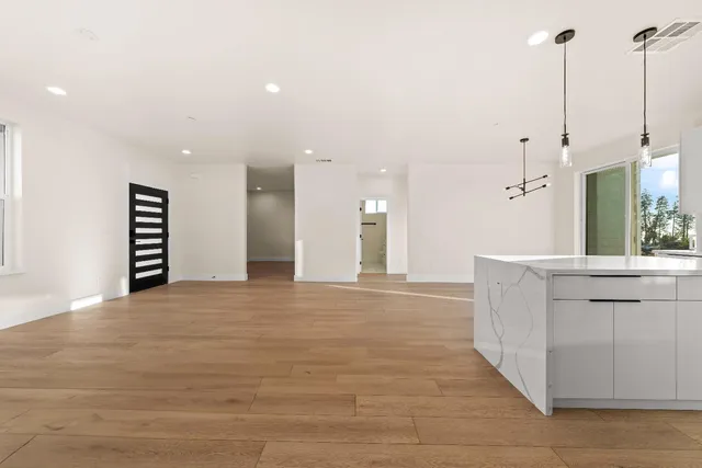 a view of a dining room furniture and kitchen view
