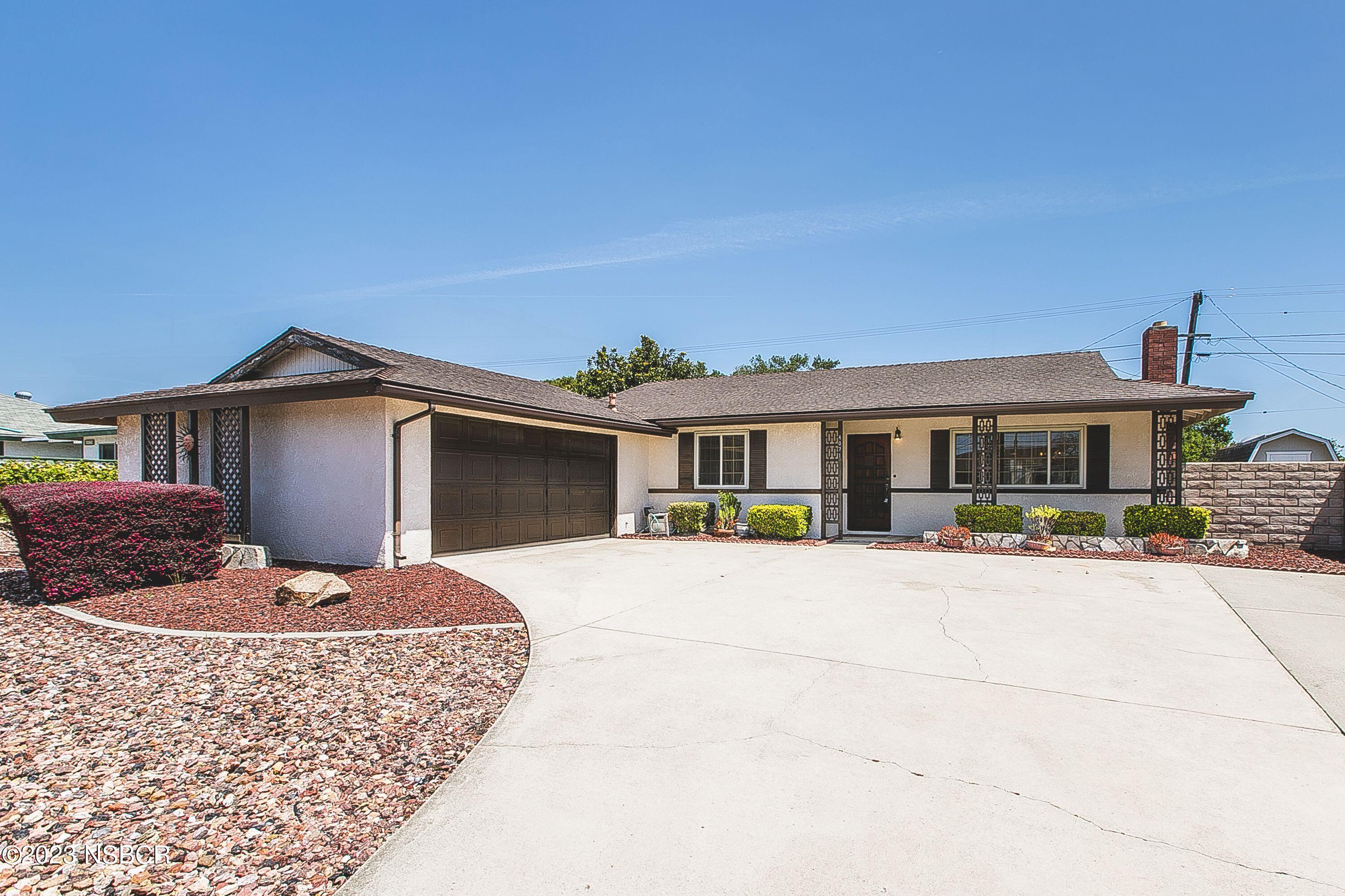 4071 Rigel Avenue Lompoc, CA 93436 - Photo 1 of 24 a front view of house with yard outdoor seating and barbeque oven