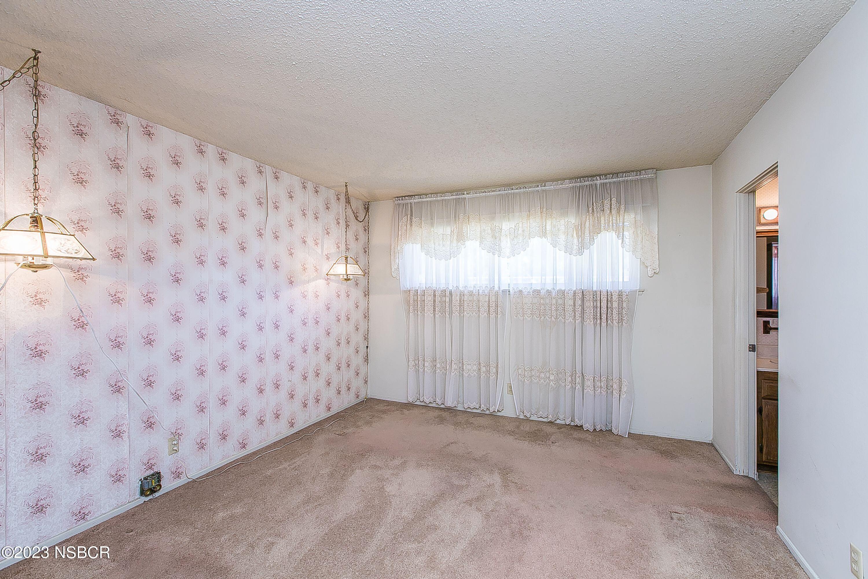 4071 Rigel Avenue Lompoc, CA 93436 - Photo 12 of 24 a view of an empty room with a window