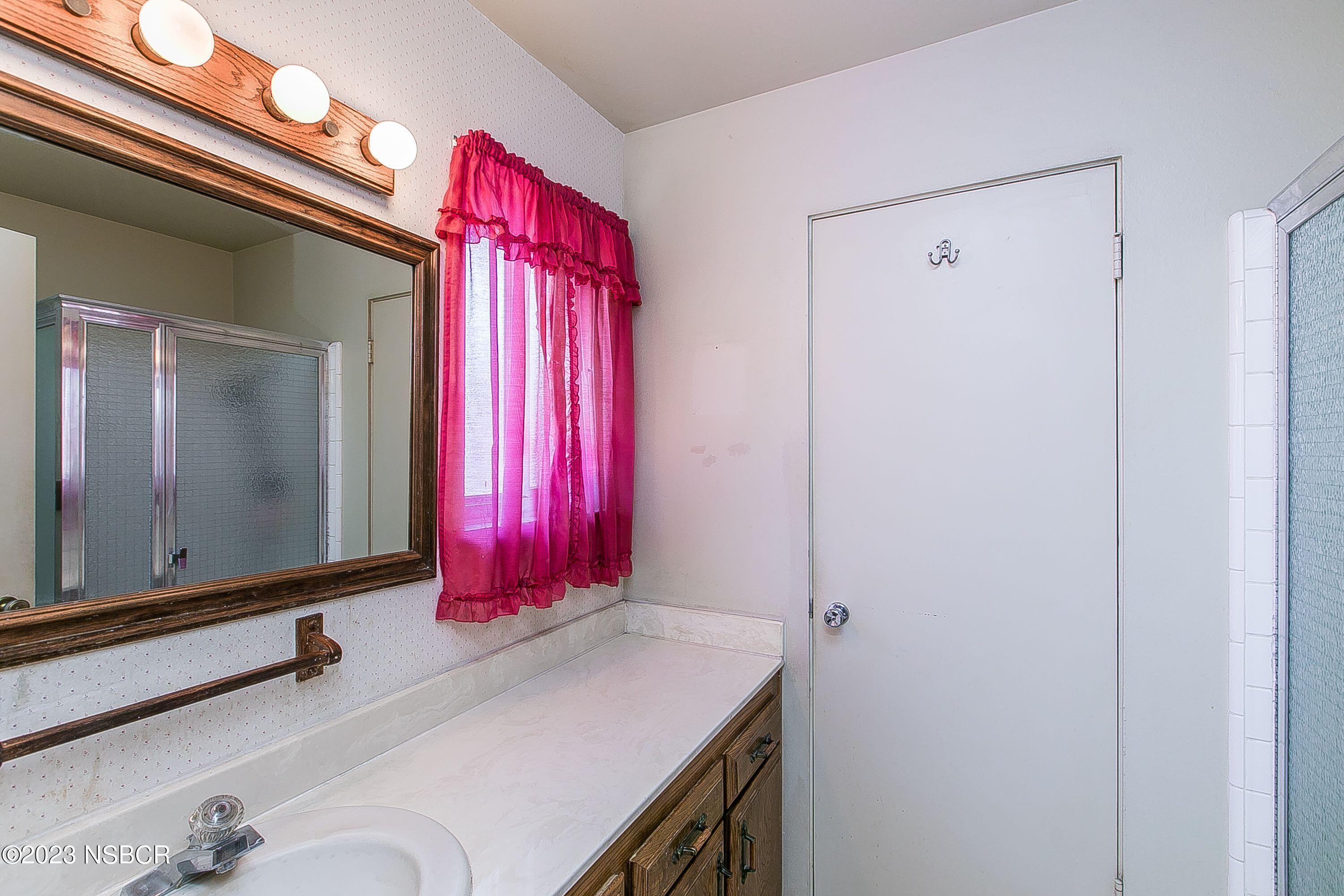 4071 Rigel Avenue Lompoc, CA 93436 - Photo 15 of 24 a bathroom with a sink vanity and a mirror