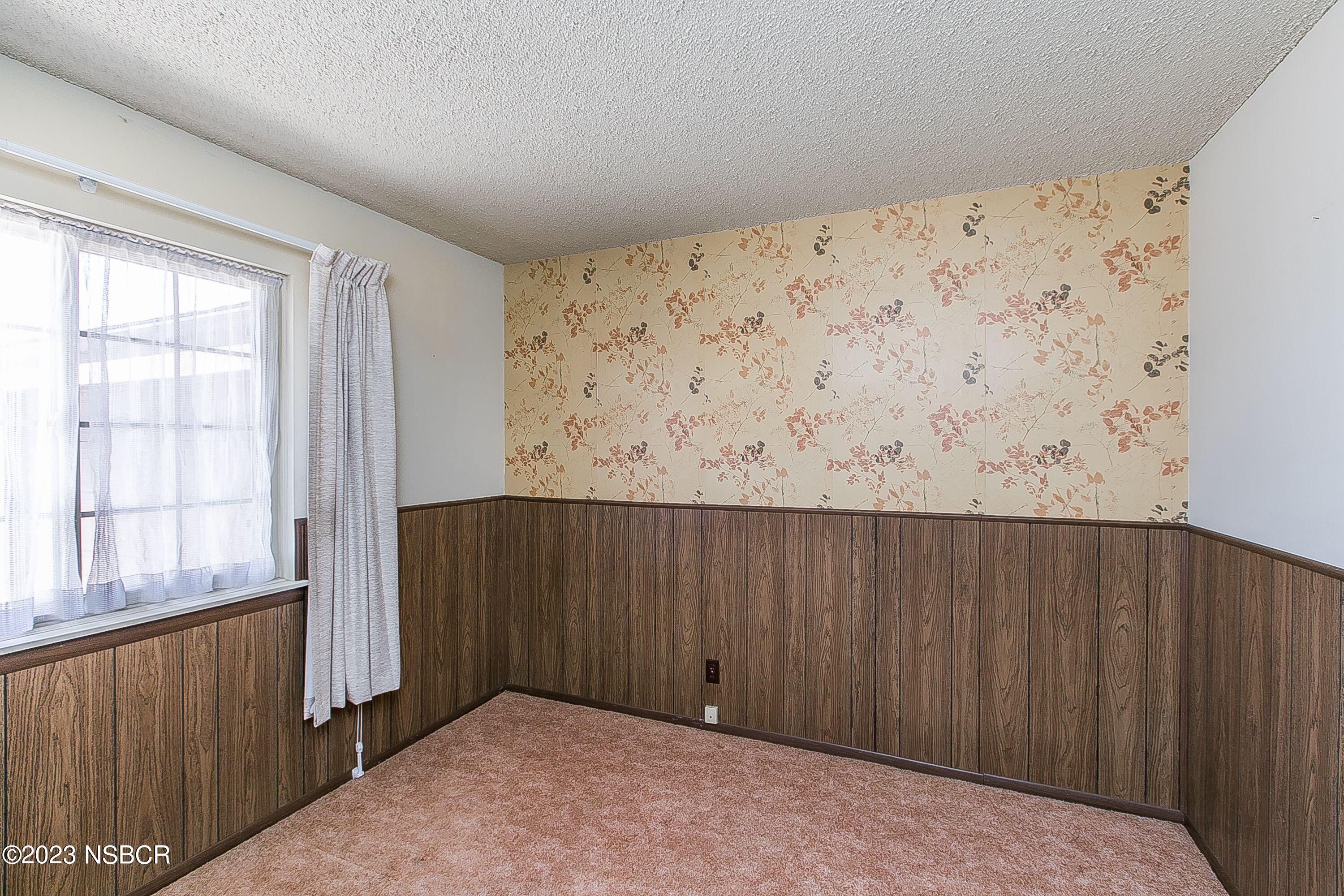 4071 Rigel Avenue Lompoc, CA 93436 - Photo 17 of 24 an empty room with a wooden door