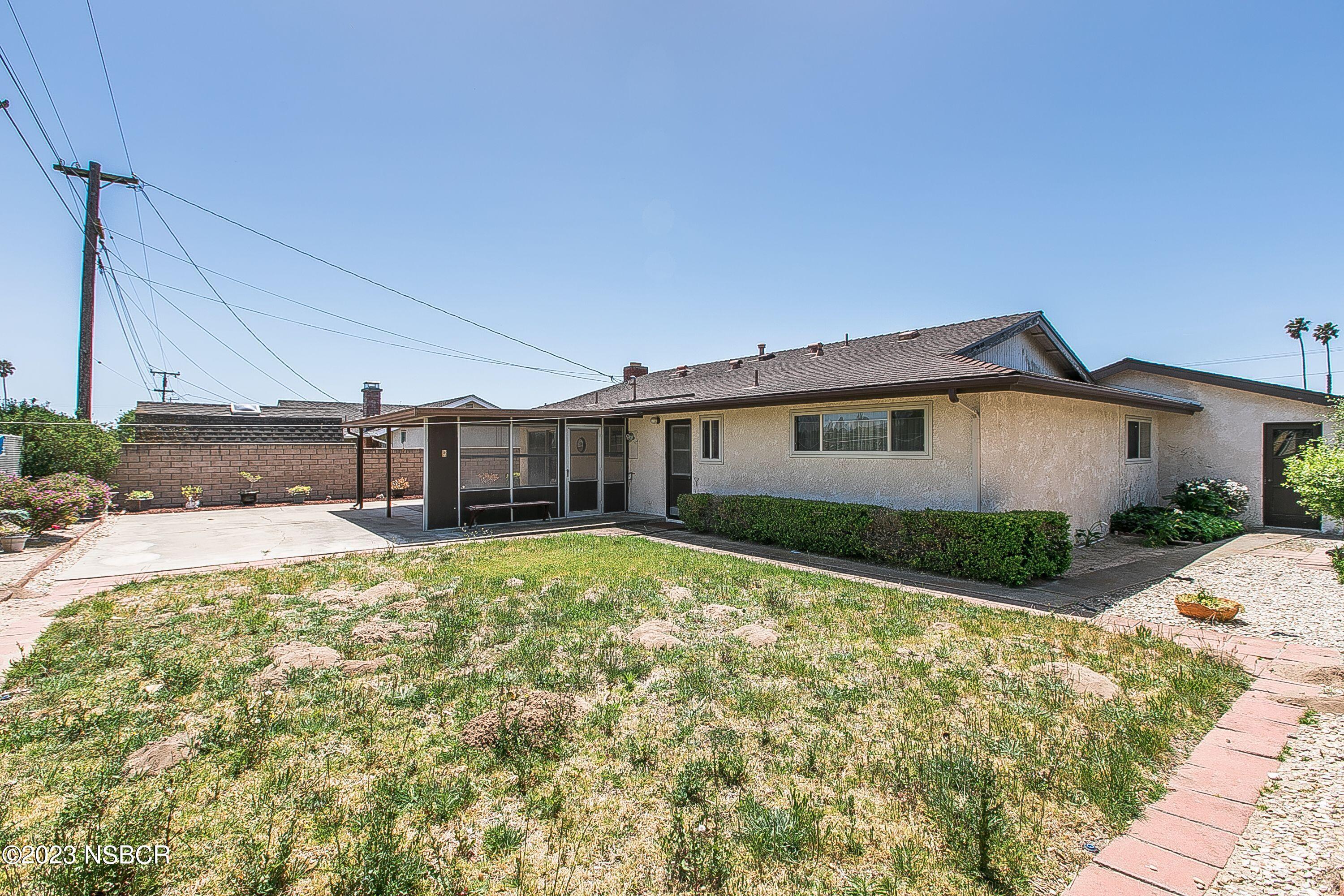 4071 Rigel Avenue Lompoc, CA 93436 - Photo 23 of 24 a view of a house with a backyard