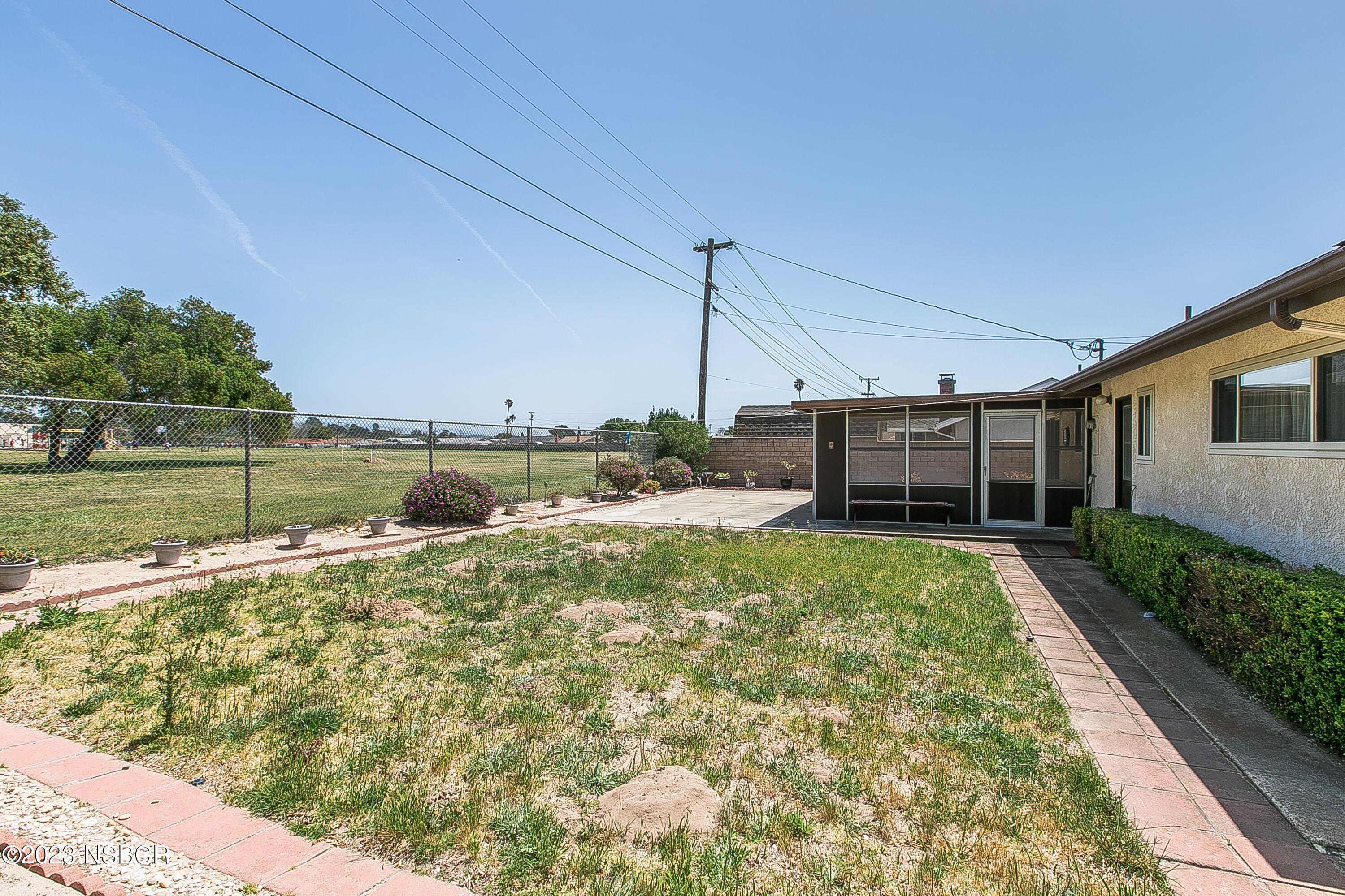 4071 Rigel Avenue Lompoc, CA 93436 - Photo 24 of 24 a view of a backyard with lawn chairs and couches