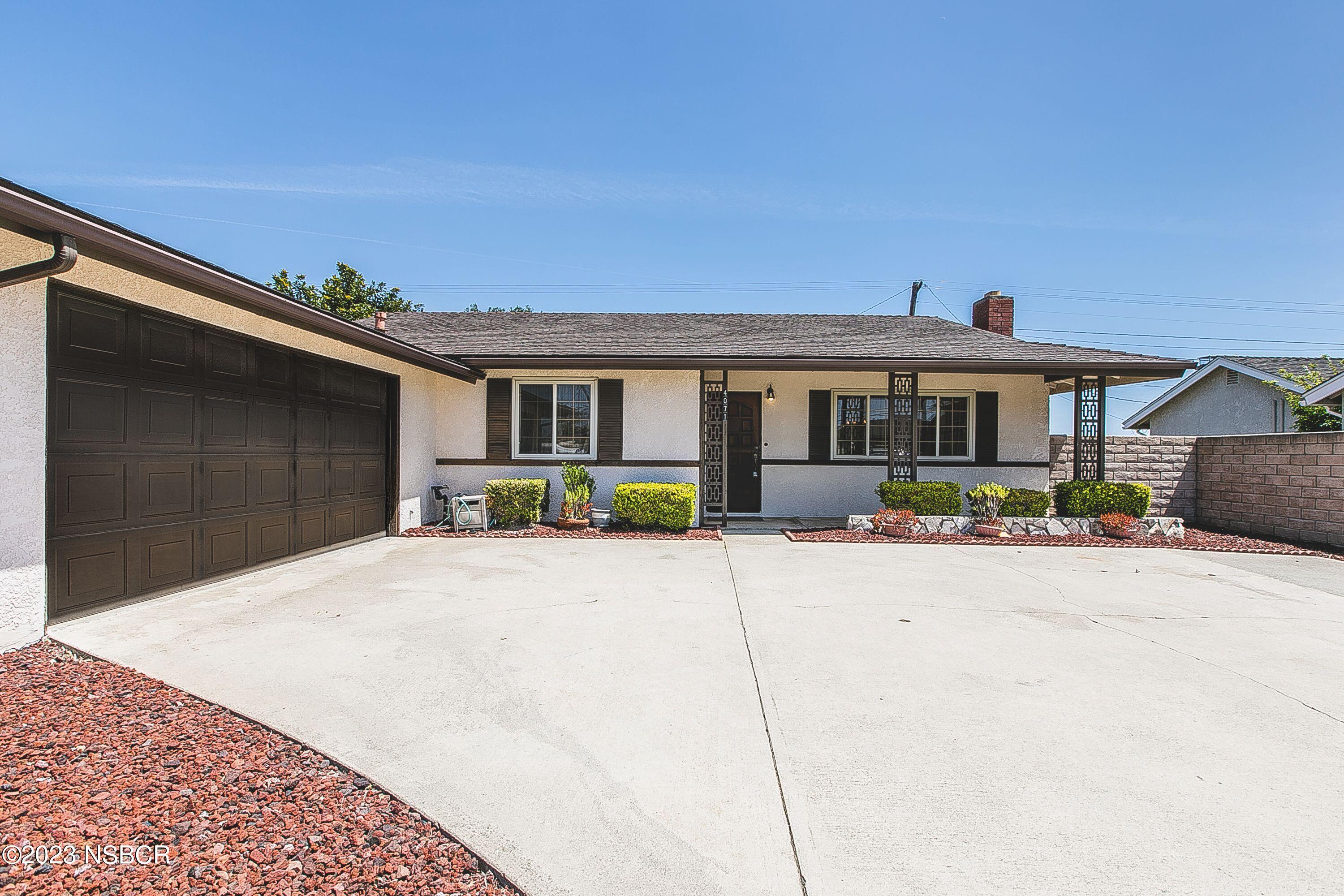 4071 Rigel Avenue Lompoc, CA 93436 - Photo 4 of 24 a front view of a house with yard and parking