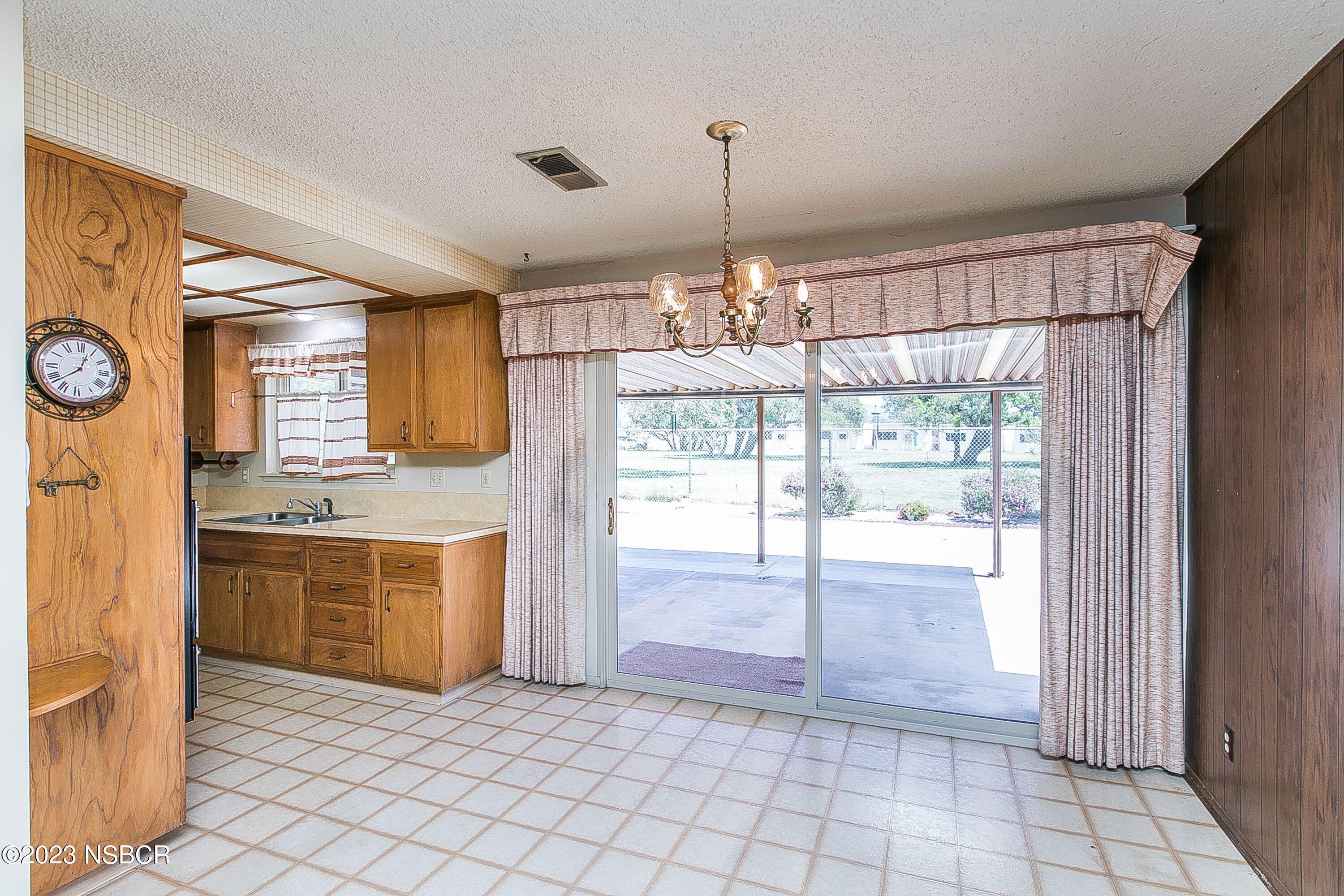 4071 Rigel Avenue Lompoc, CA 93436 - Photo 7 of 24 a view of a kitchen with a sink and a stove top oven