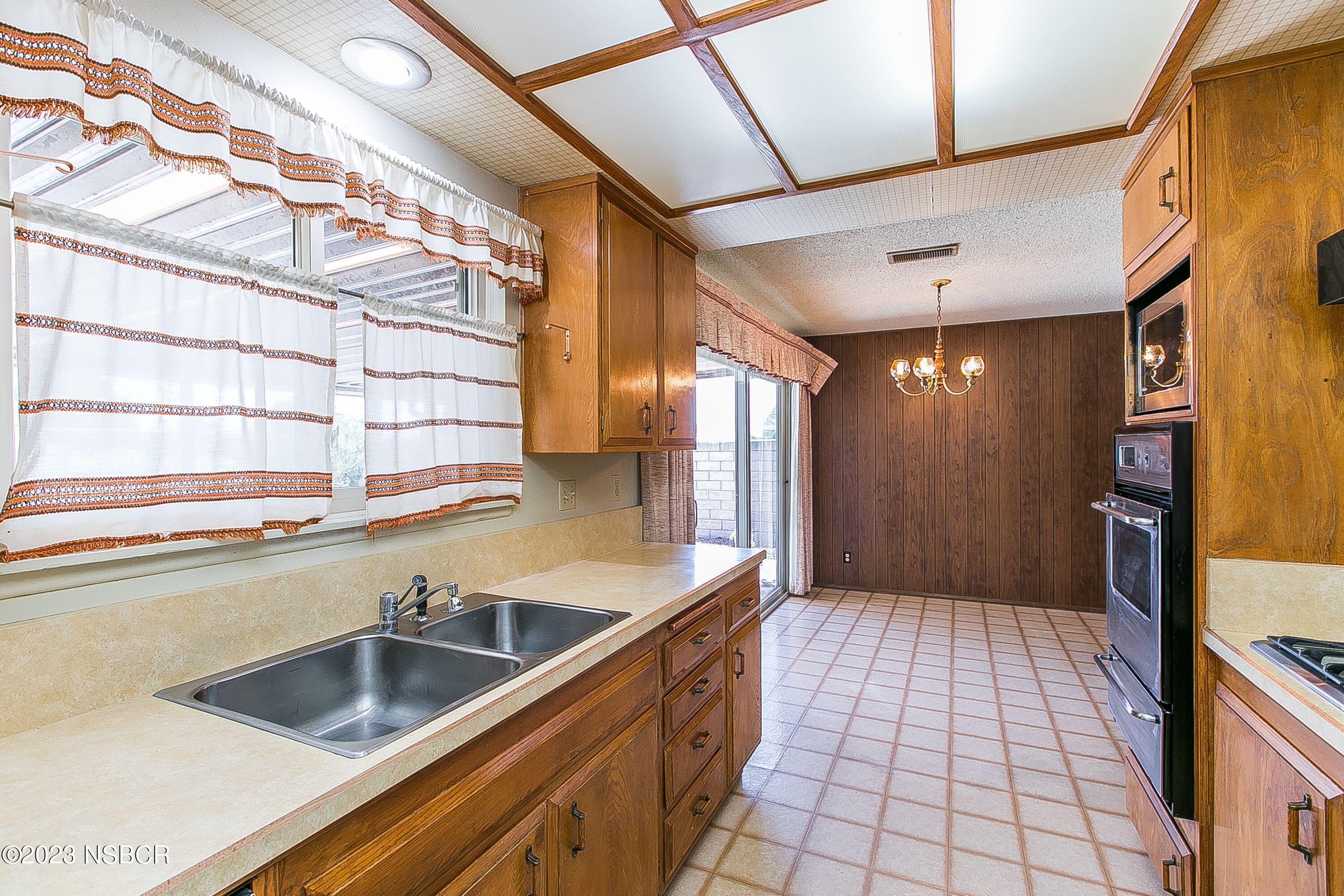 4071 Rigel Avenue Lompoc, CA 93436 - Photo 10 of 24 a kitchen with a sink and cabinets