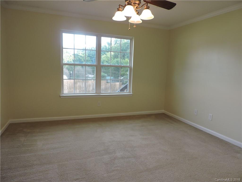 598 Lickstone Road Waynesville, NC 28786 - Photo 17 of 32 an empty room with a window