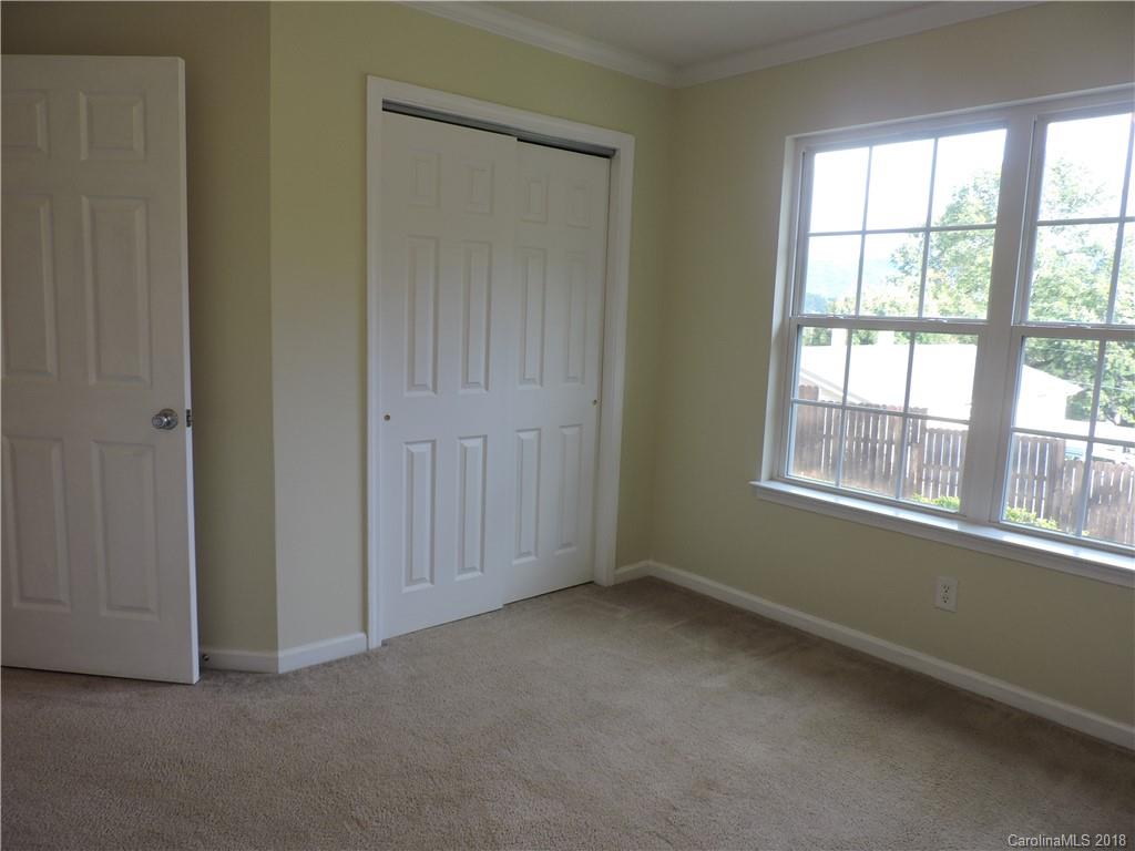 598 Lickstone Road Waynesville, NC 28786 - Photo 19 of 32 a view of an empty room with a window