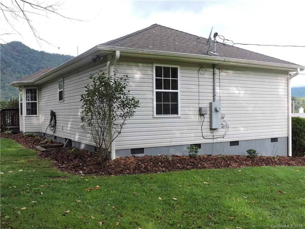 598 Lickstone Road Waynesville, NC 28786 - Photo 28 of 32 a view of a house with a yard