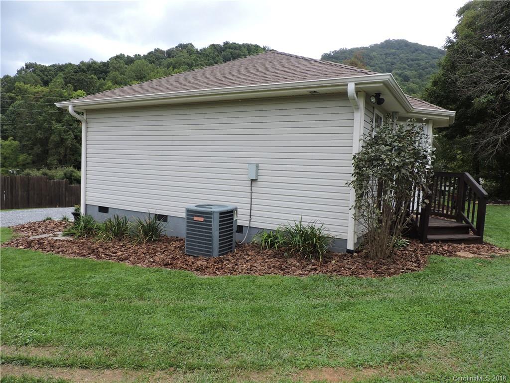 598 Lickstone Road Waynesville, NC 28786 - Photo 30 of 32 a view of a house with a yard