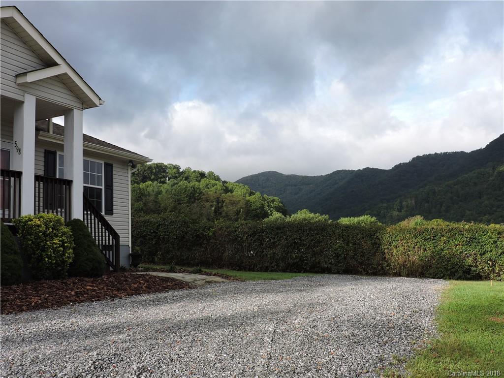 598 Lickstone Road Waynesville, NC 28786 - Photo 3 of 32 a view of a back yard