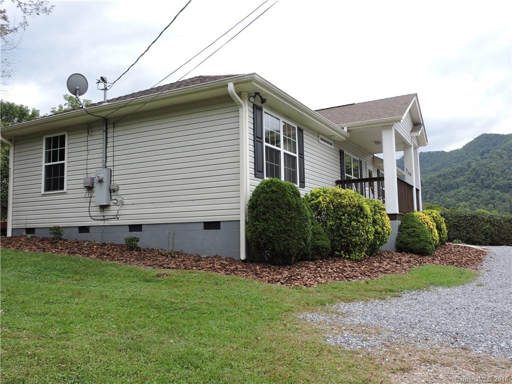 598 Lickstone Road Waynesville, NC 28786 - Photo 5 of 32 a view of a house with a yard and plants