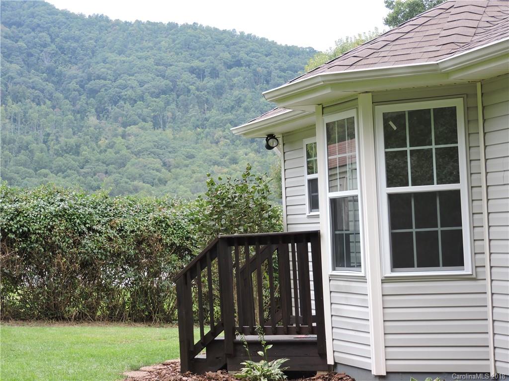 598 Lickstone Road Waynesville, NC 28786 - Photo 6 of 32 a view of a house with a yard