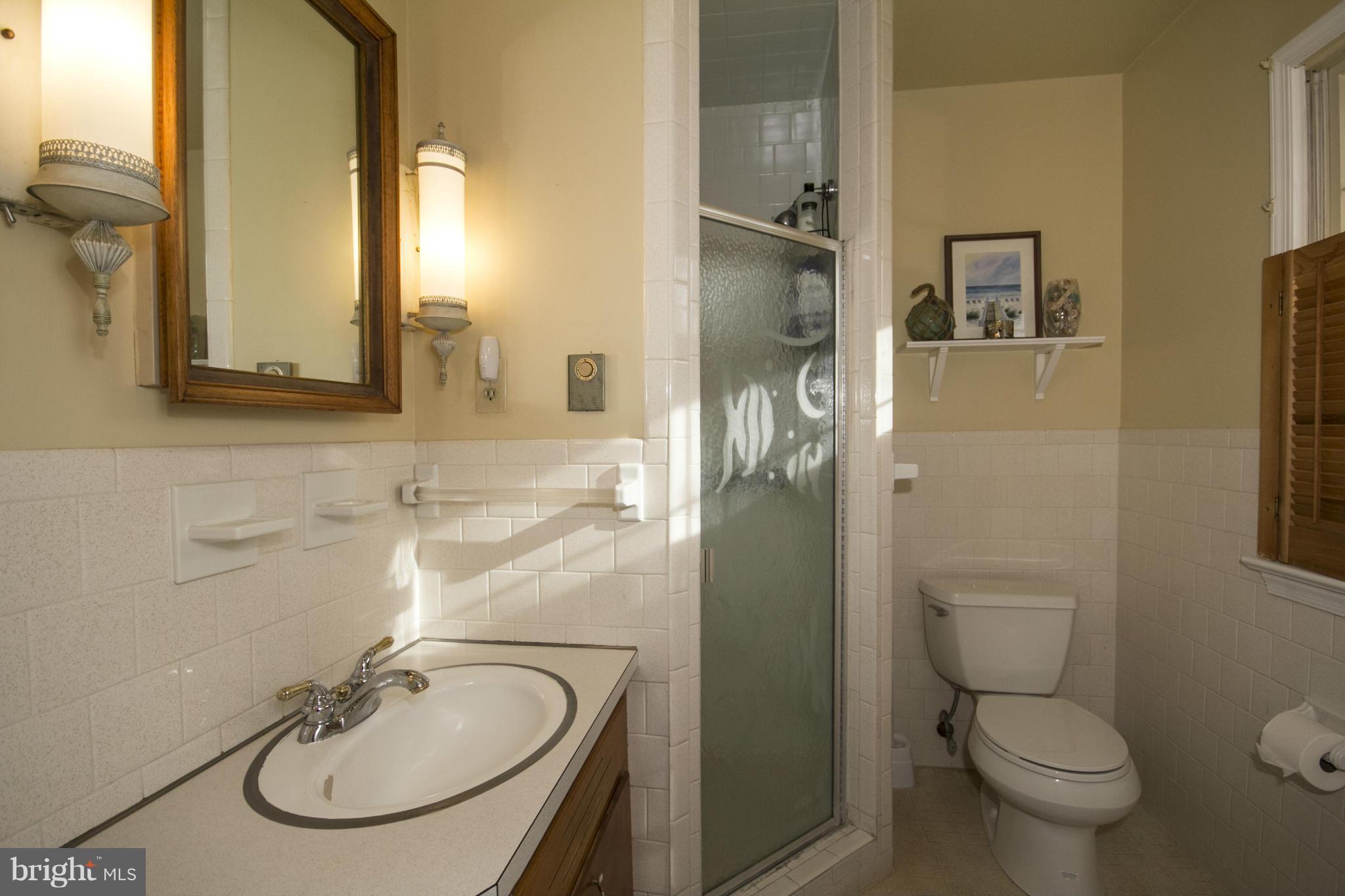 5207 Middleburg Road Union Bridge, MD 21791 - Photo 22 of 30 a bathroom with a sink a toilet and a mirror