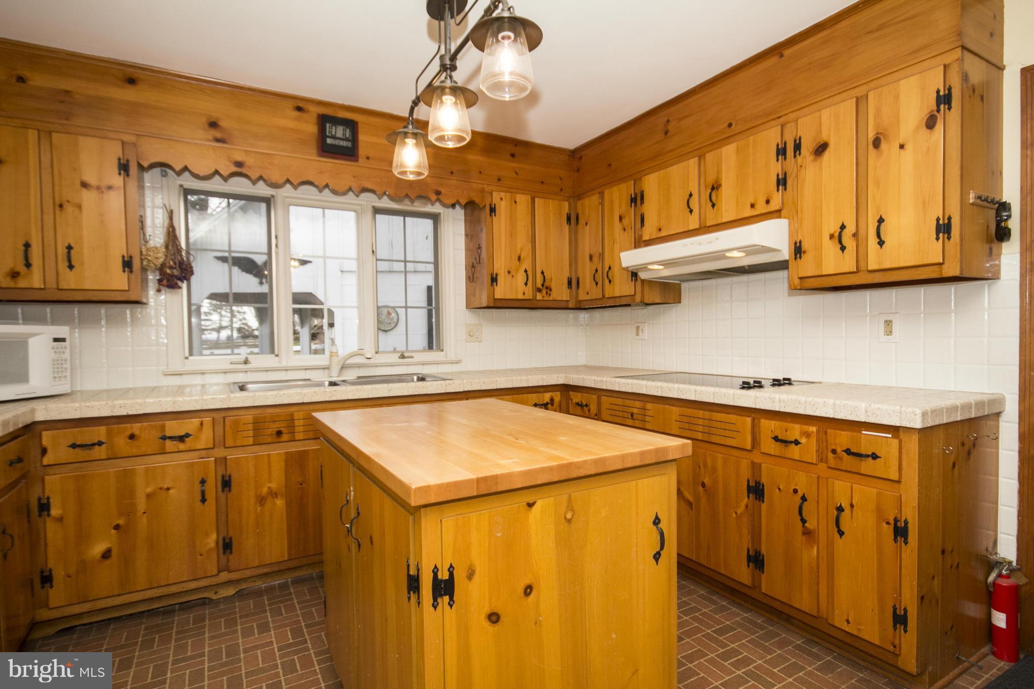 5207 Middleburg Road Union Bridge, MD 21791 - Photo 8 of 30 a kitchen with stainless steel appliances granite countertop a sink and cabinets