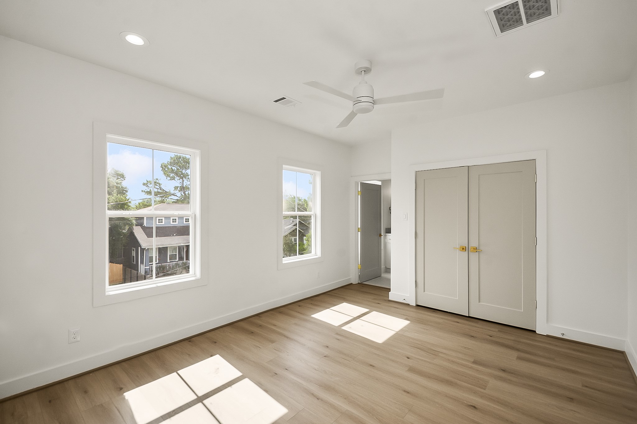 1109 Tabor Street Houston, TX 77009 - Photo 24 of 38 a view of empty room with wooden floor and fan