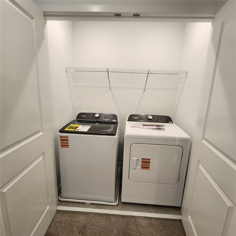 4232 Sadler Road Apopka, FL 32712 - Photo 16 of 31 a utility room with dryer and washer