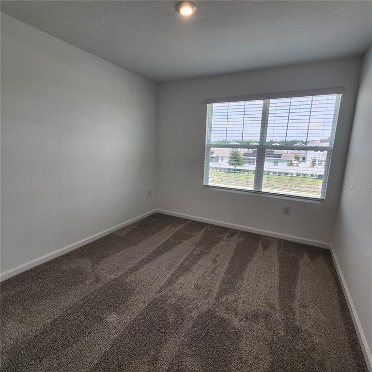 4232 Sadler Road Apopka, FL 32712 - Photo 19 of 31 an empty room with a window