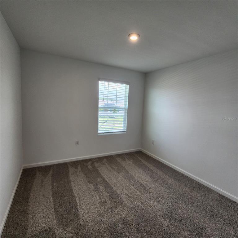 4232 Sadler Road Apopka, FL 32712 - Photo 21 of 31 an empty room with a window