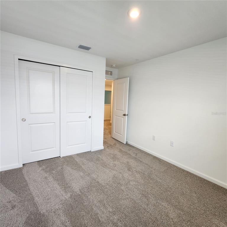 4232 Sadler Road Apopka, FL 32712 - Photo 22 of 31 an empty room with closet area