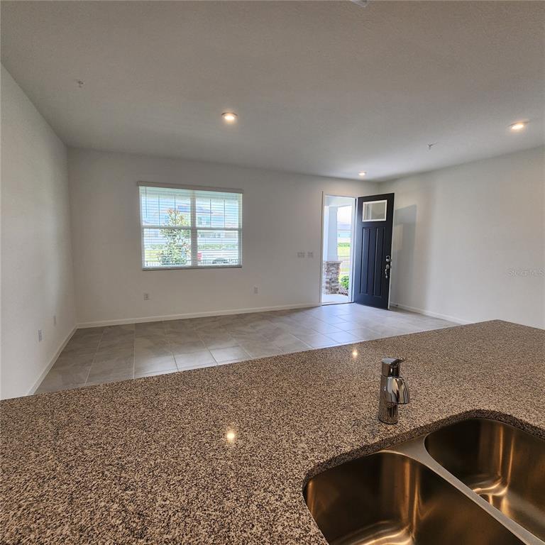 4232 Sadler Road Apopka, FL 32712 - Photo 4 of 31 a view of a kitchen counter top space and a sink
